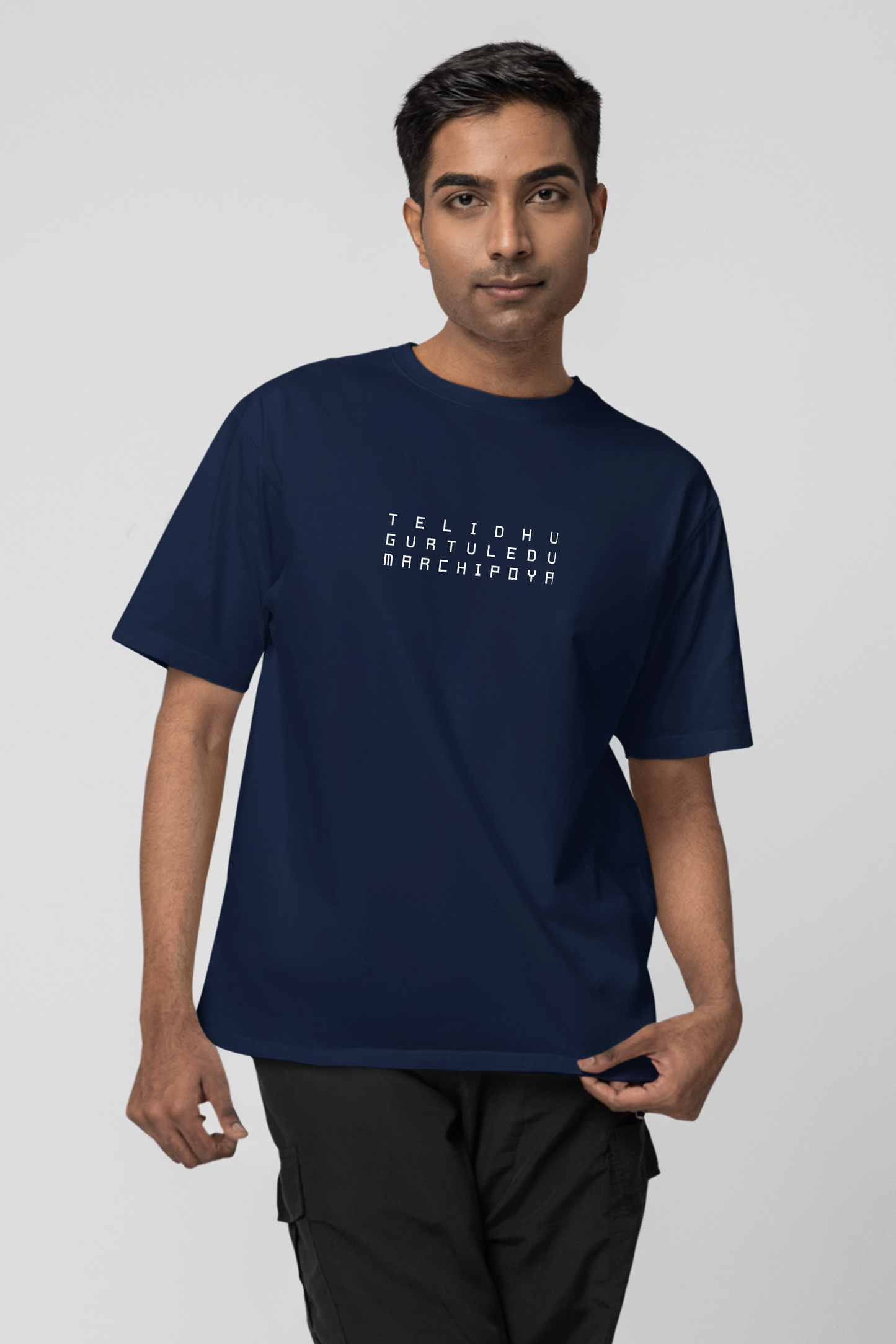 Man wearing a navy blue t-shirt with text on a light gray background
